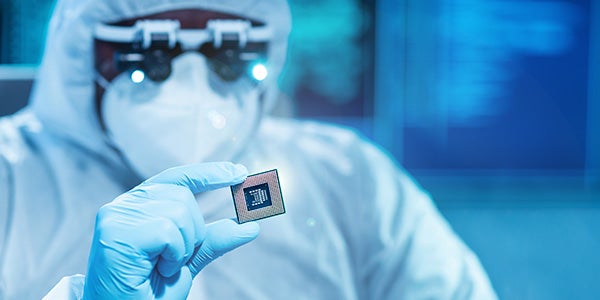 Person holding electronic chip